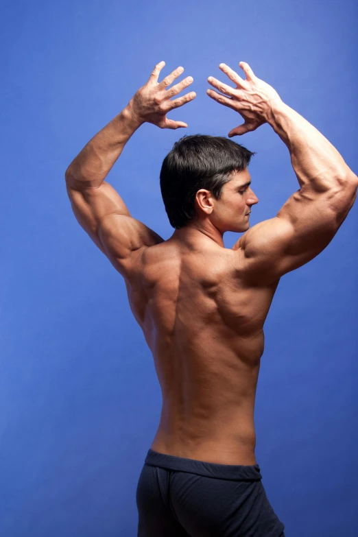 a guy is stretching with his muscles