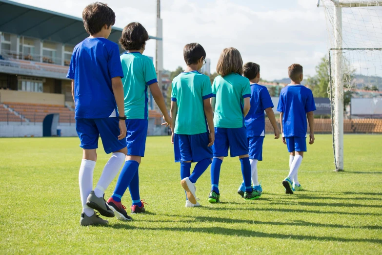 the boy's soccer team is ready to play against each other