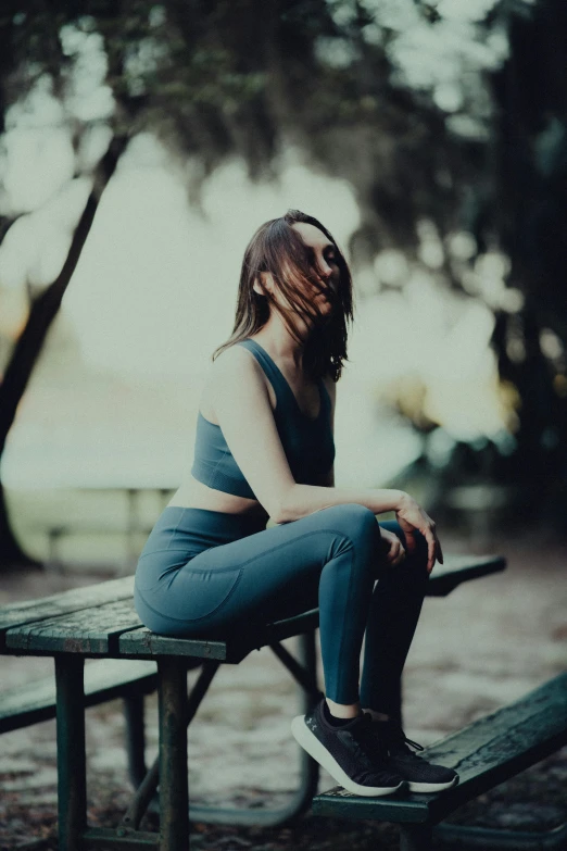 a person sitting on top of a bench