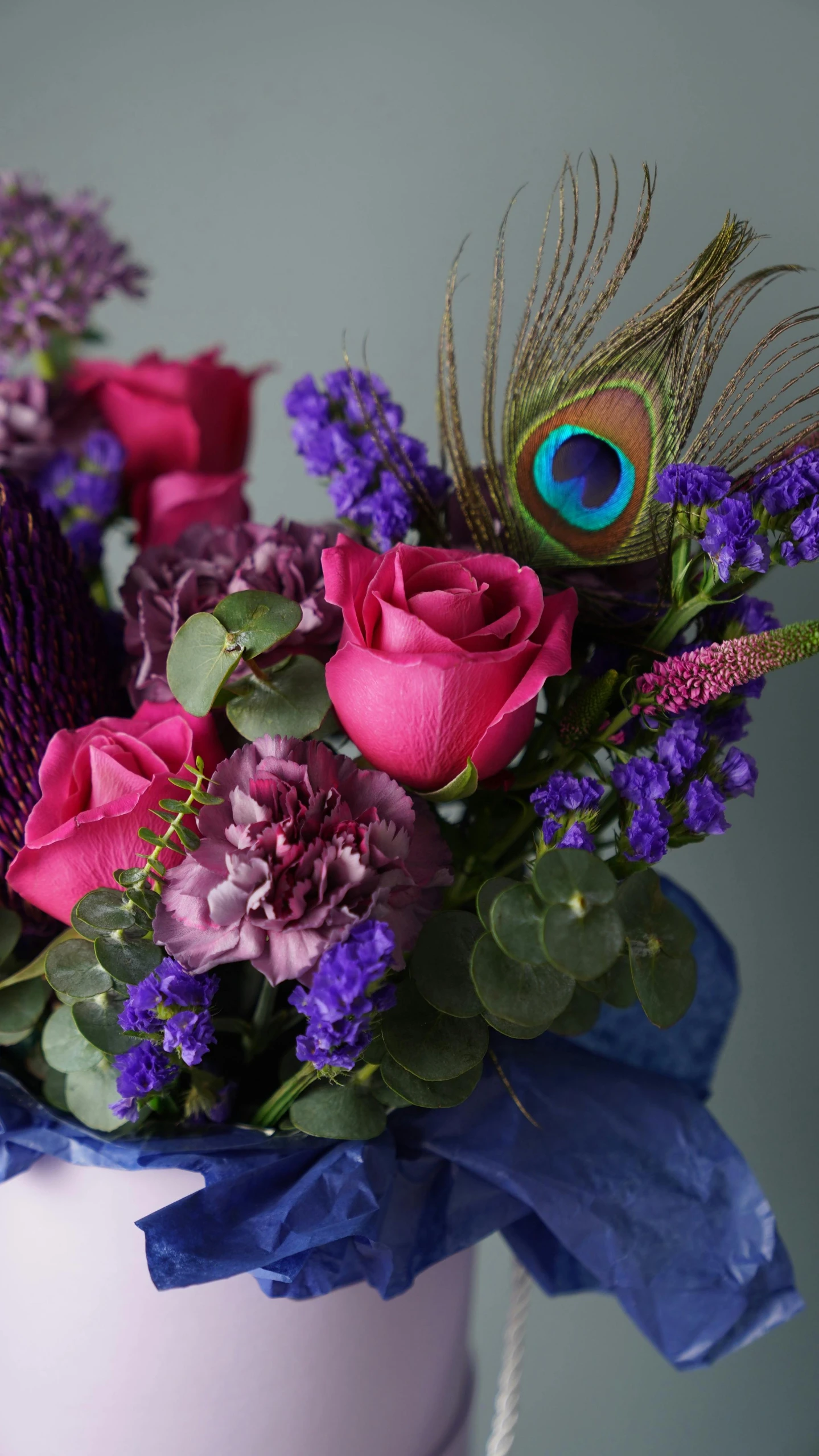 the colorful bouquet is decorated with purple flowers