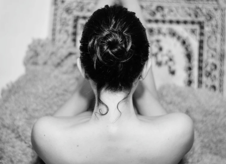 an asian woman with a back bun on her head