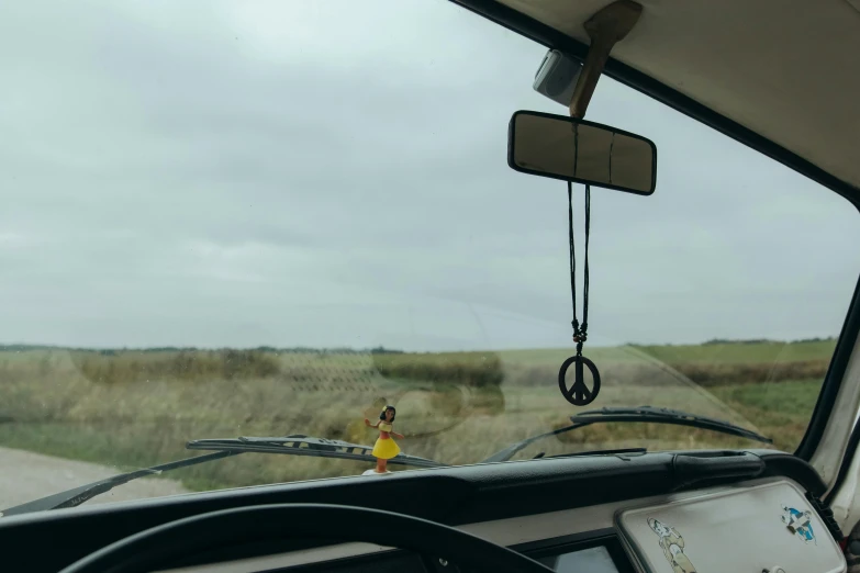 woman in a yellow shirt walking through the country