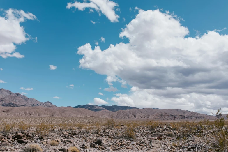 a desert area in the desert with a blue sky above it