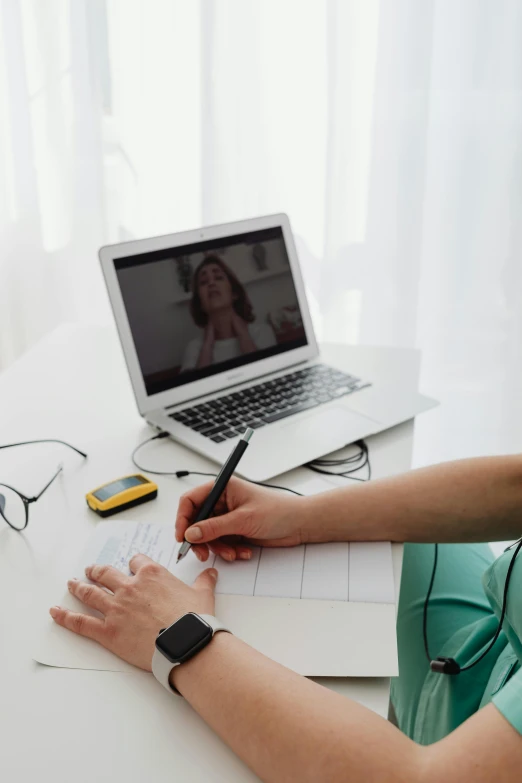 a lady is looking at soing on a computer screen