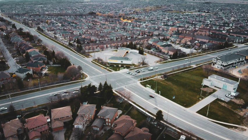 an aerial view of a city with a highway