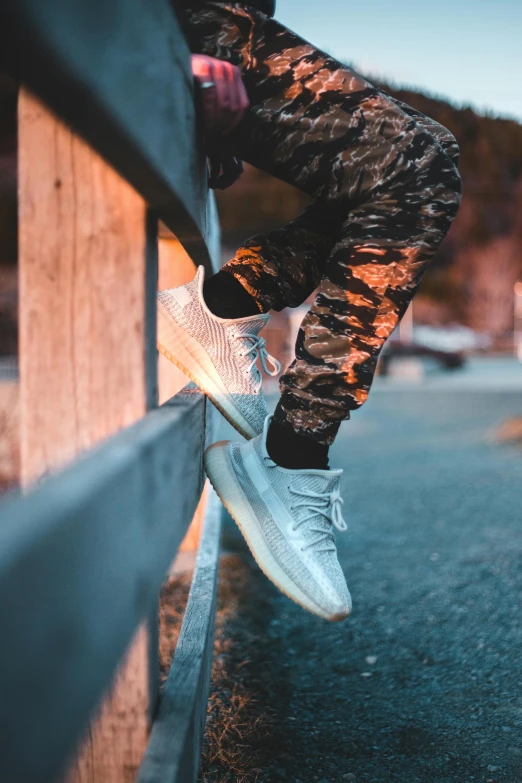 the legs of someone in shoes and leggings on a skateboard