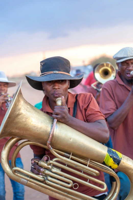 a man with a band playing on his musical instrument