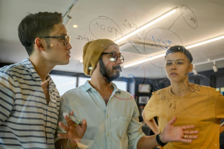 a group of people standing around in a room