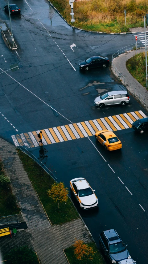 a street with cars going through an intersection