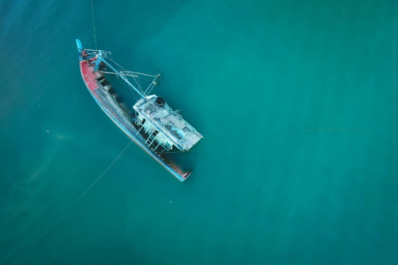 a ship floating in the ocean on the water