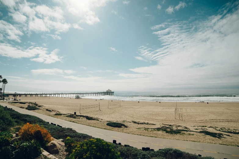 the view from the top of a sand covered beach area