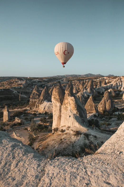 there is a  air balloon that has just taken off into the sky