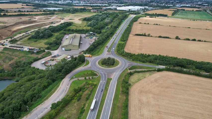 an aerial view of a busy highway surrounded by crops