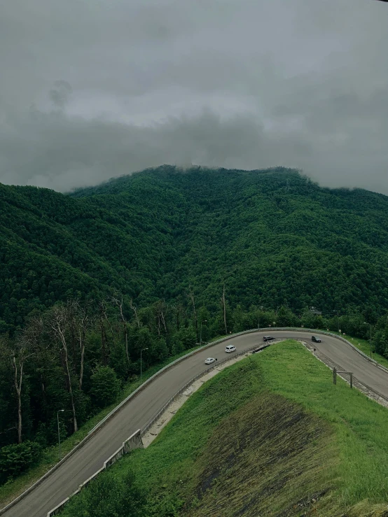 an aerial view of a road that looks to be winding