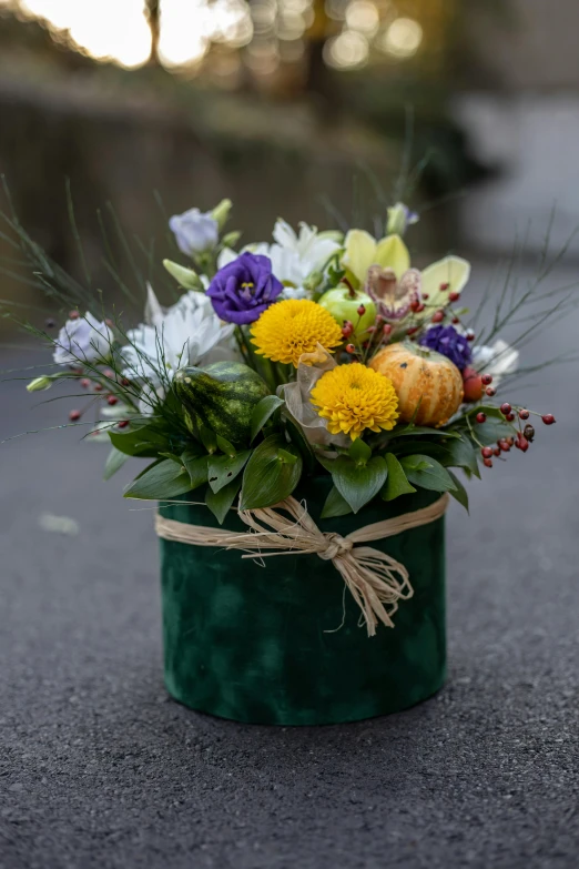 a bouquet of flowers in a green vase