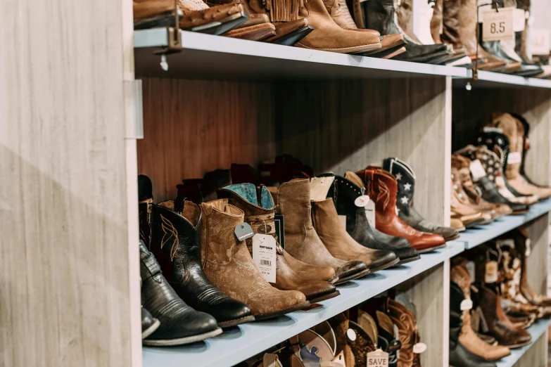 many different colored boots lined up on shelves