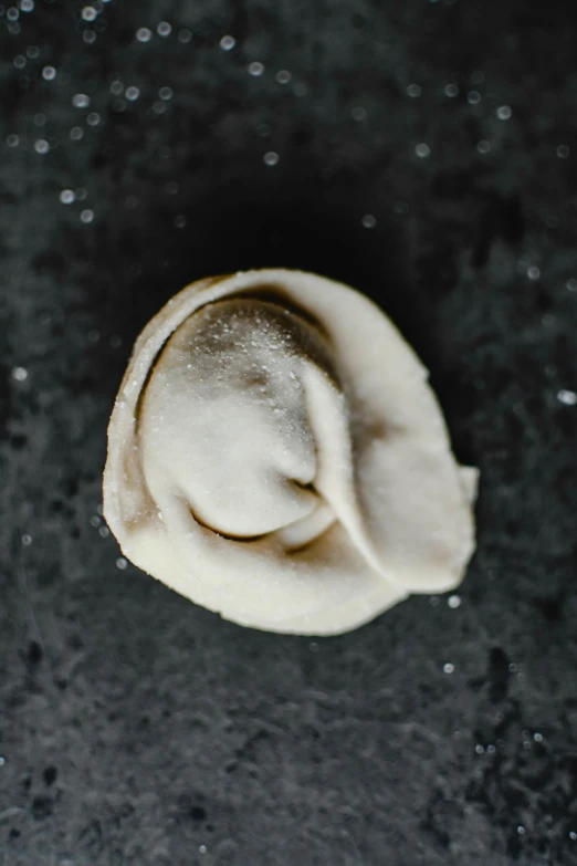 an uncooked, raw dough is covered in icing