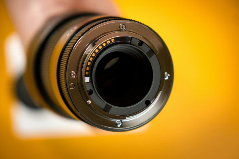a camera lens attached to the body of a camera