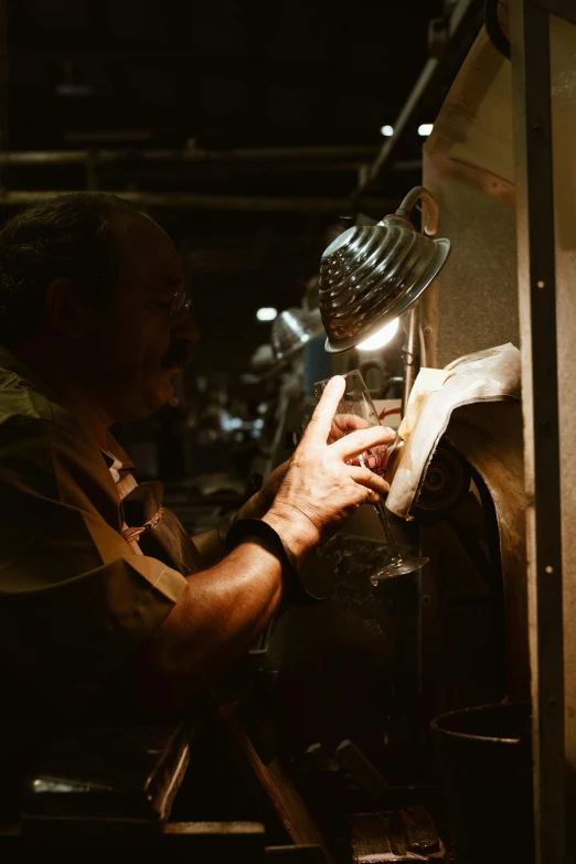 an older man is working in a factory