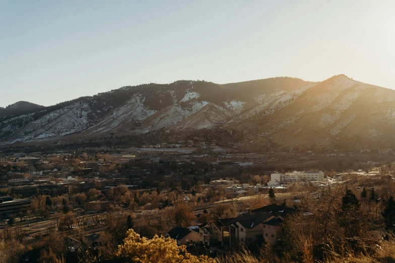 there is a view of a town and a mountain range