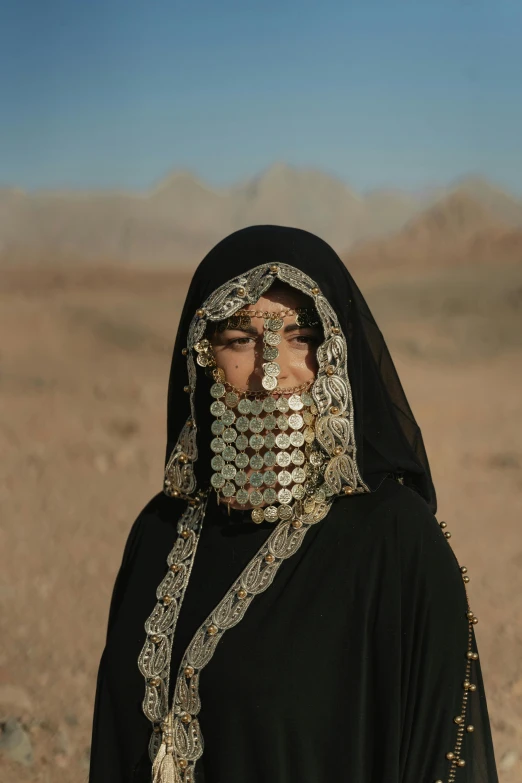 a woman with an elaborate head piece on her face