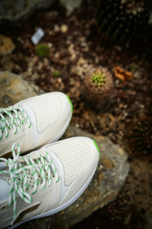 someone is in their sneakers outside in the dirt