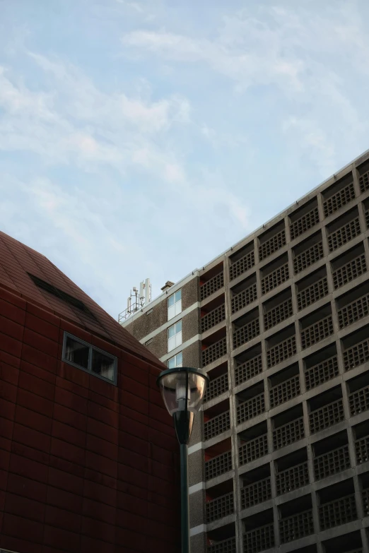 a brown building and a red brick structure with signs