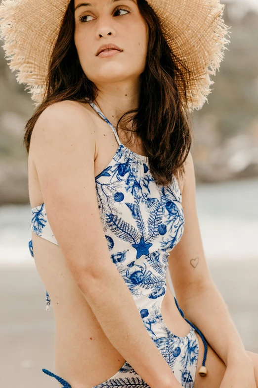 a woman posing for a po in her bathing suit