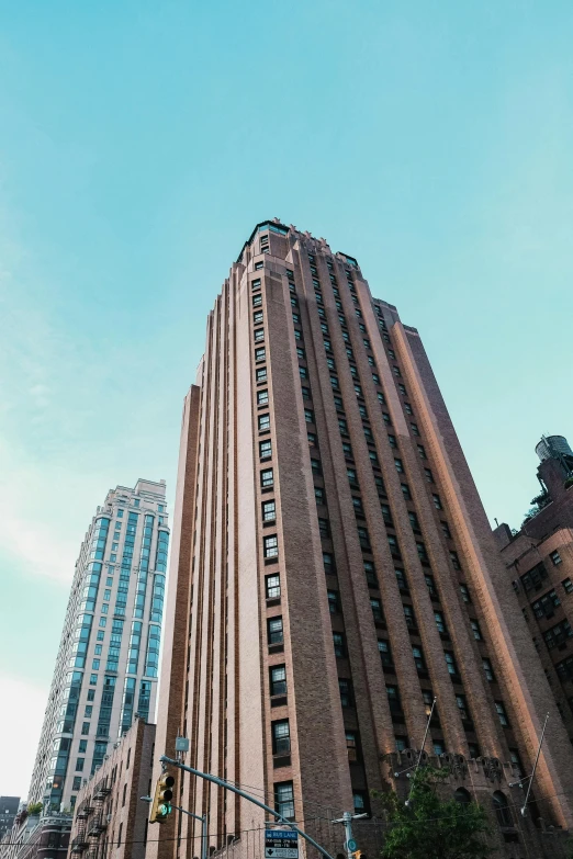 the view of a tall building with skyscrs in the background