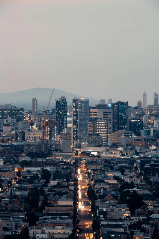 some tall buildings that are sitting in the middle of the night