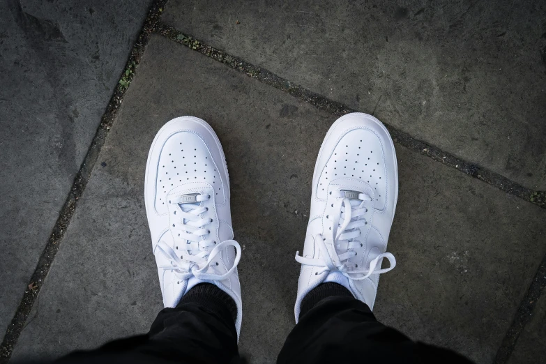 a pair of sneakers that are wearing blue and white