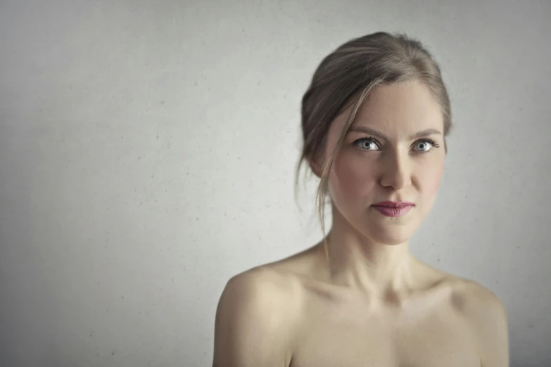 a close up of a woman posing for a picture