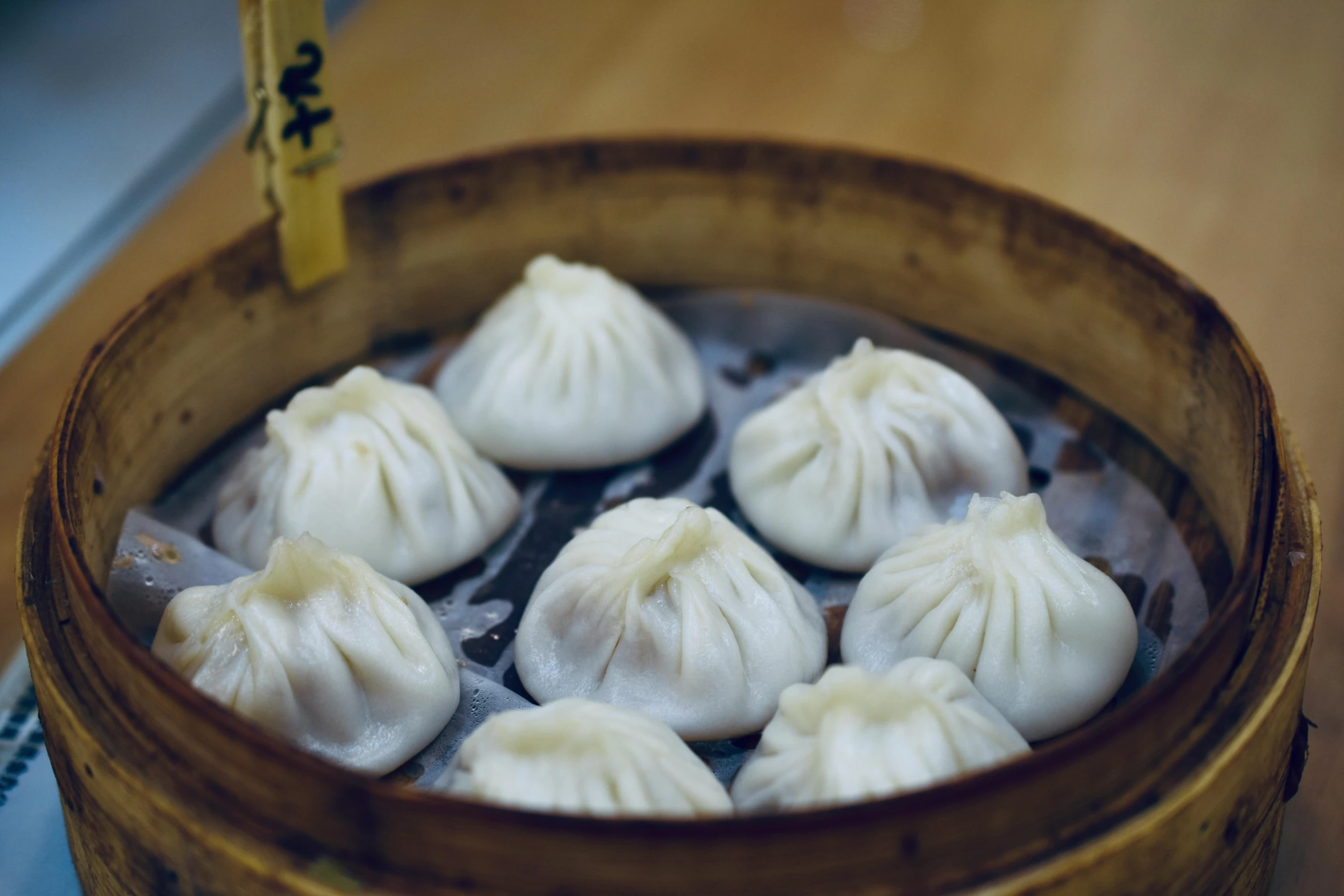 the dumplings are in an asian bamboo basket