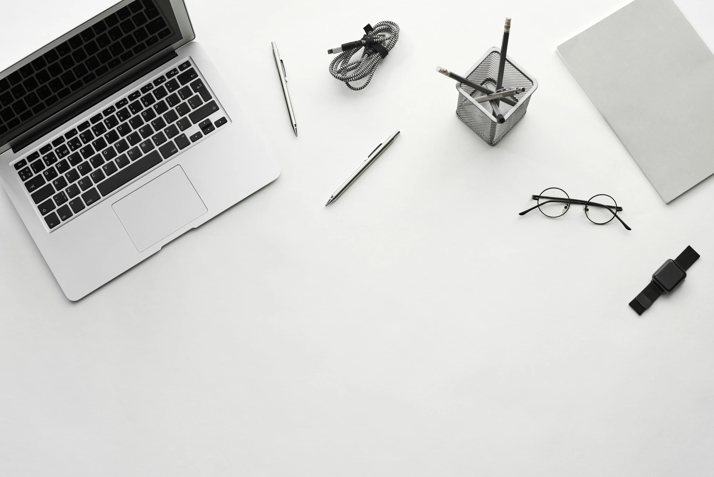 an open laptop sitting on top of a table