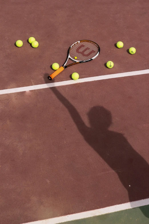 a man is about to serve a tennis ball on a court