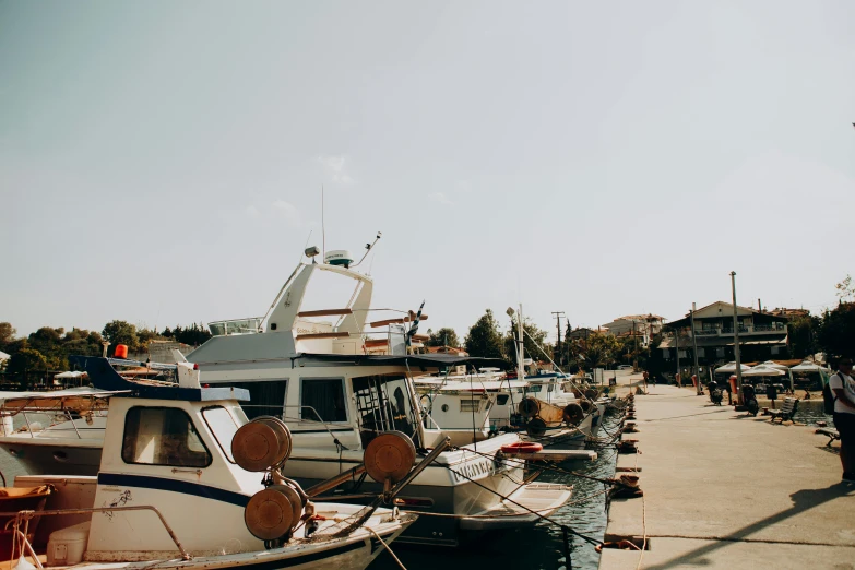 the large boats are parked on the beach