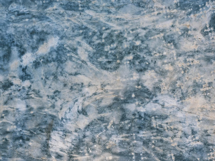 a large area of blue and brown marble with white highlights