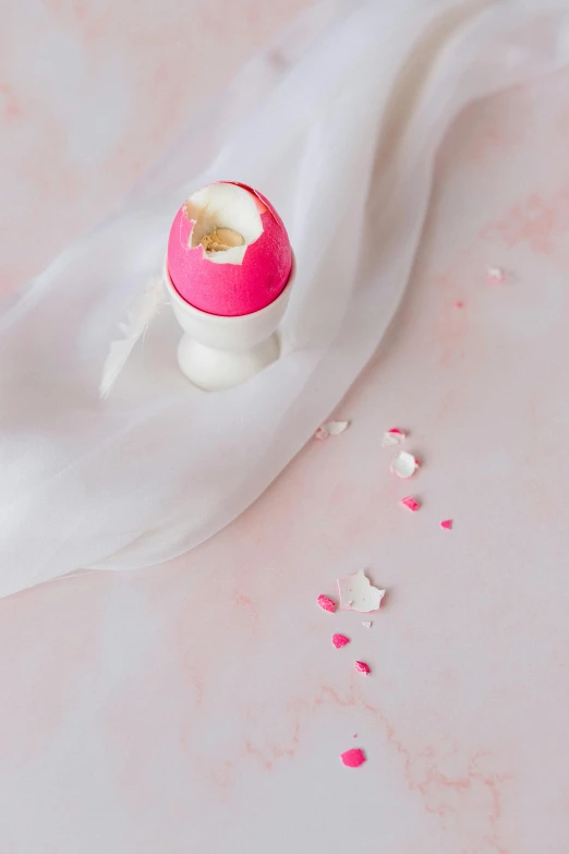 a pink object is stuck inside of a white cotton