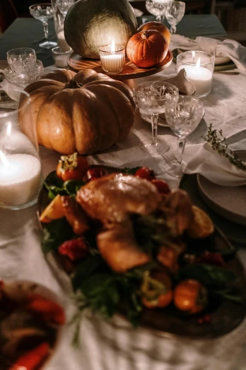 a table set with various foods and a candle