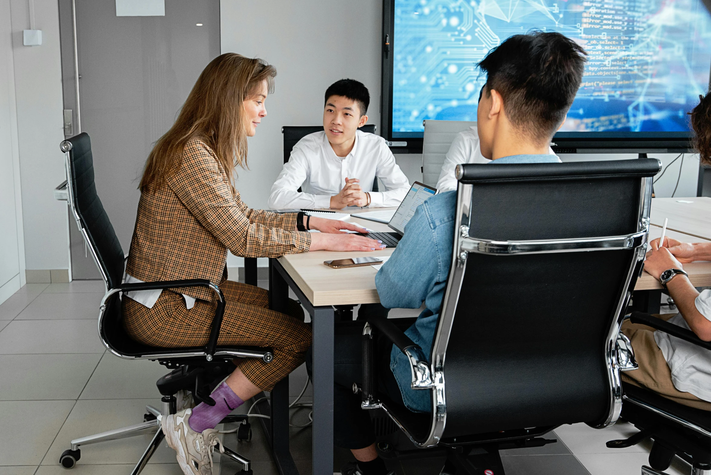 people at a table working with the business people