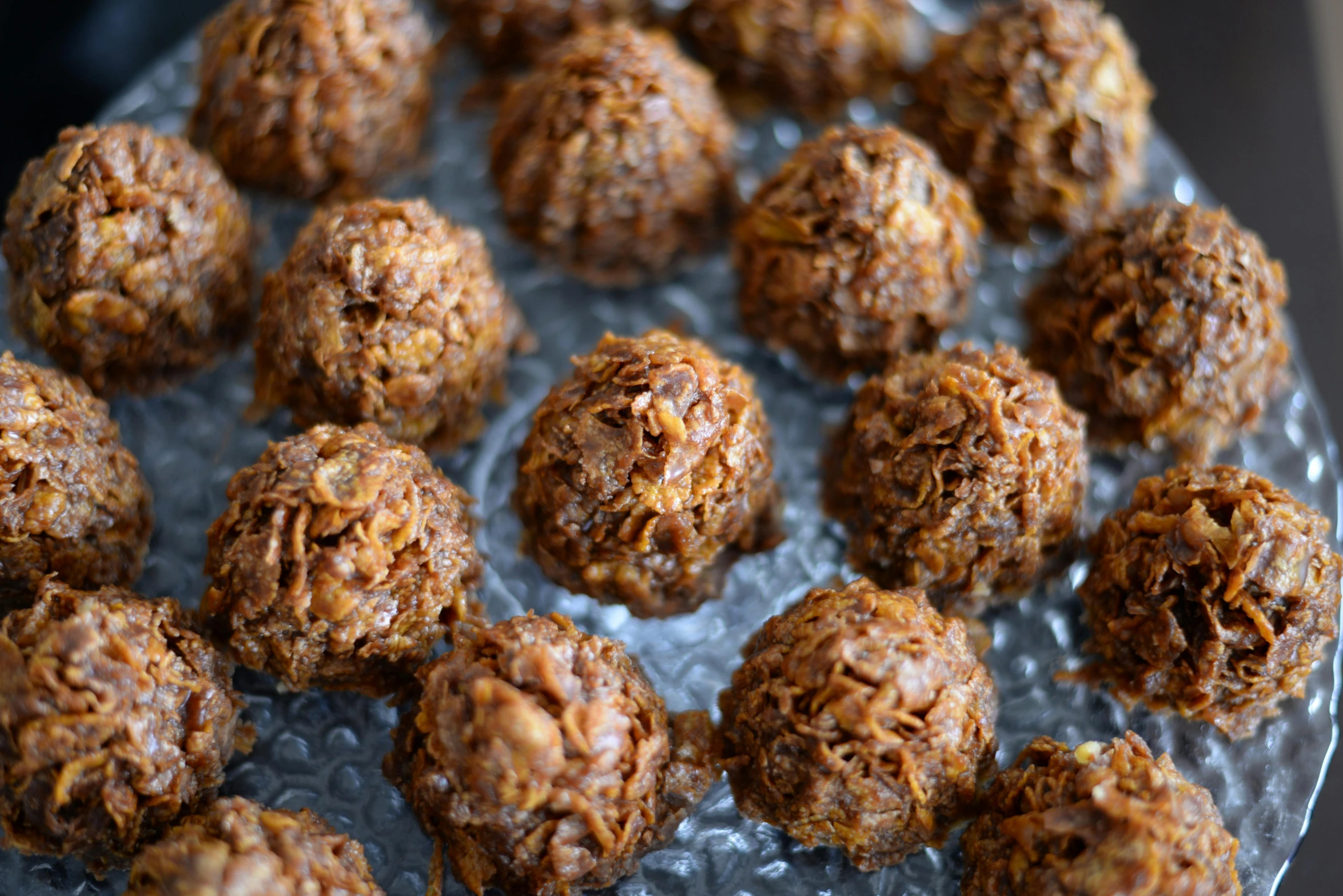 a bunch of no bakes sitting in a tin pan