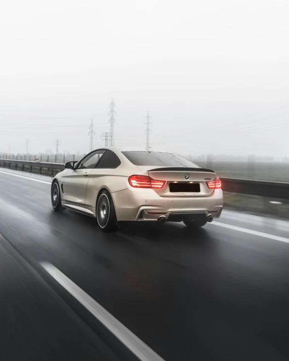 the rear view of a bmw z4 in motion