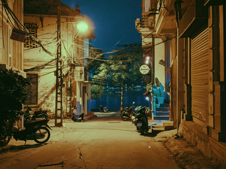 two motorcycles parked in the street next to each other