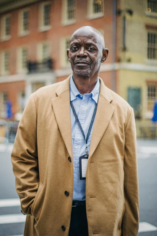 a man is standing in front of a cross walk