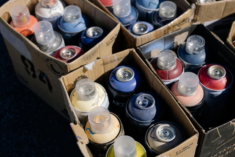 a box filled with containers and containers sitting on top of a floor