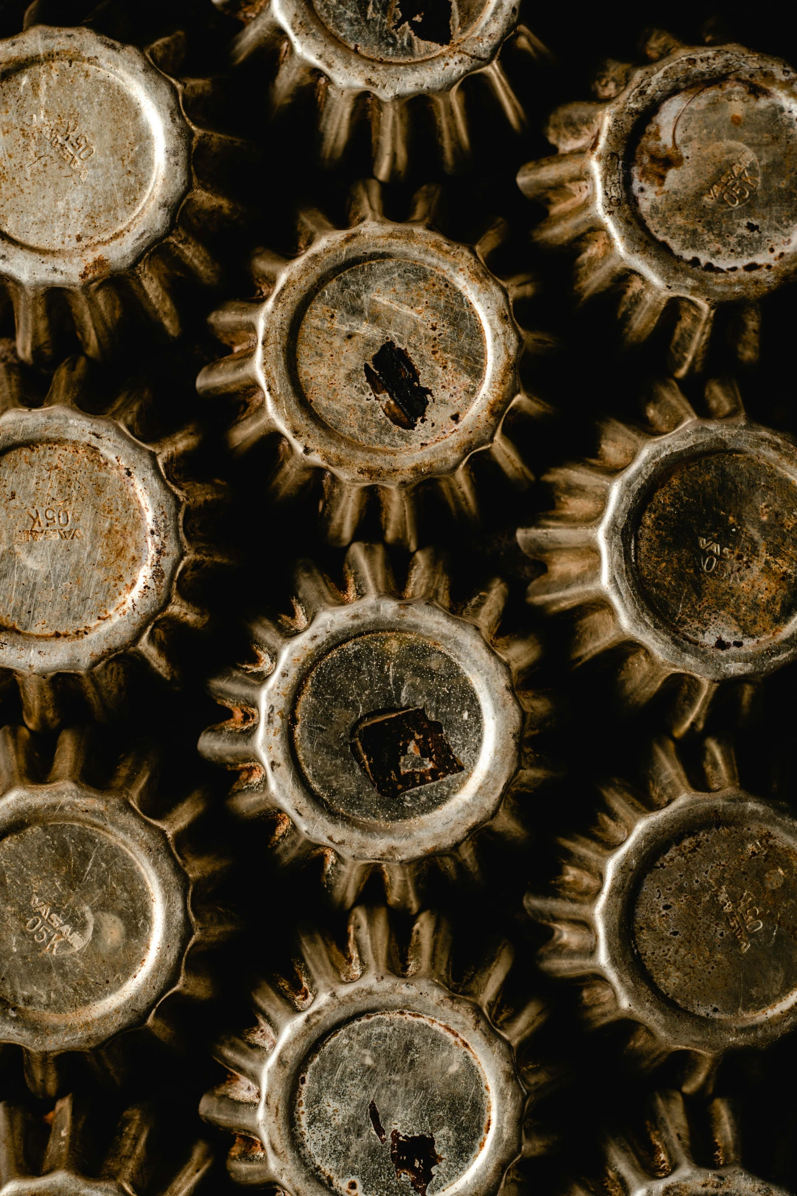 the top and bottom of some old, rusty plastic bottles