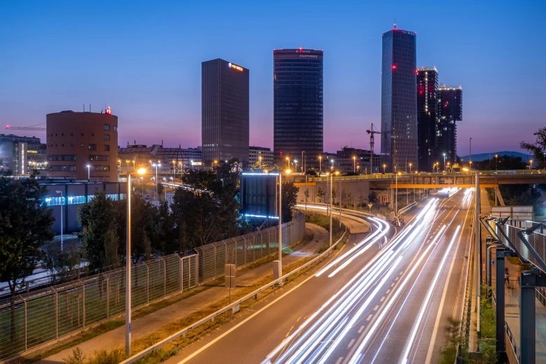 cityscape with blurry lights at night on a freeway