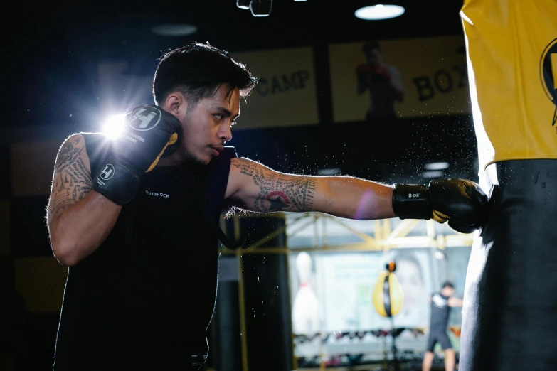 a man hitting a punching bag with a ring