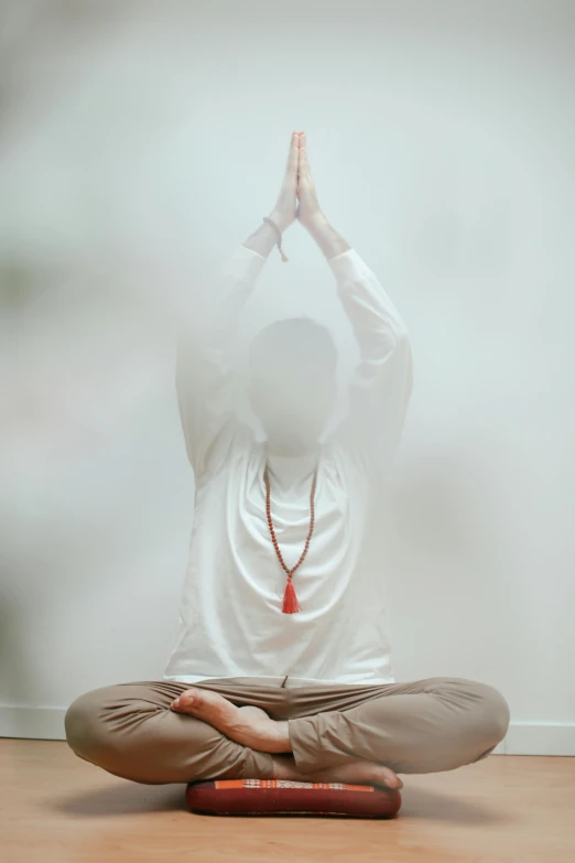 a person doing yoga in a foggy area