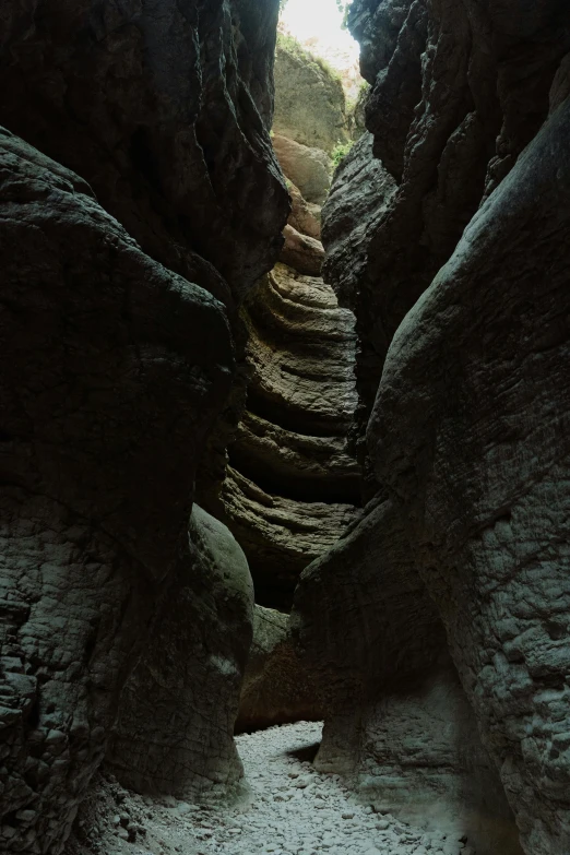 several narrow stairs going through an area that is mostly rocky